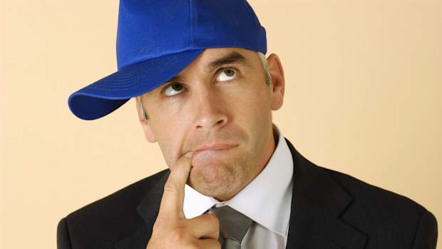 Confused guy in baseball hat (stock photo)